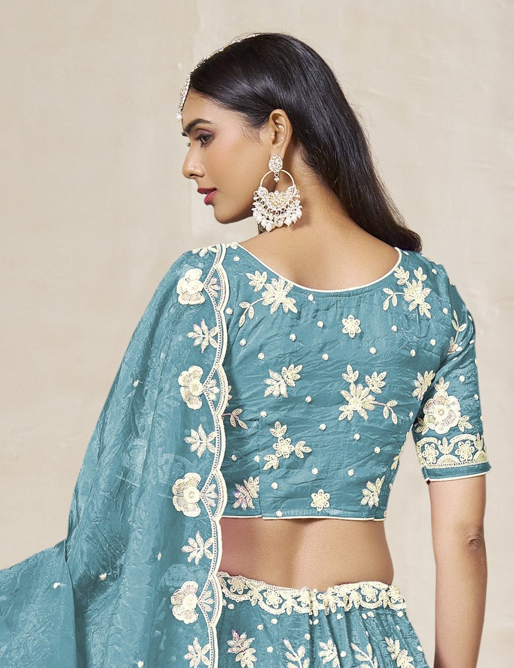 Tarani teal organza lehenga back view with embroidery details