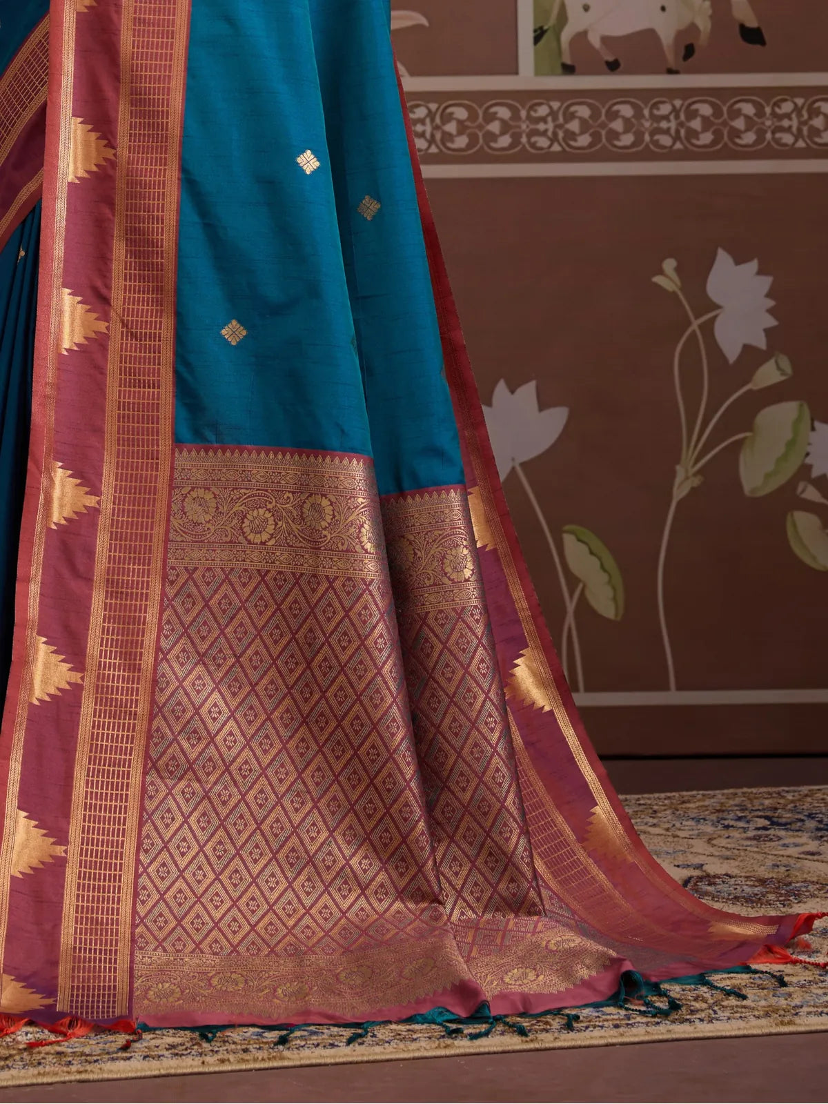 Tarani premium silk saree pallu view in blue and maroon with detailed zari border