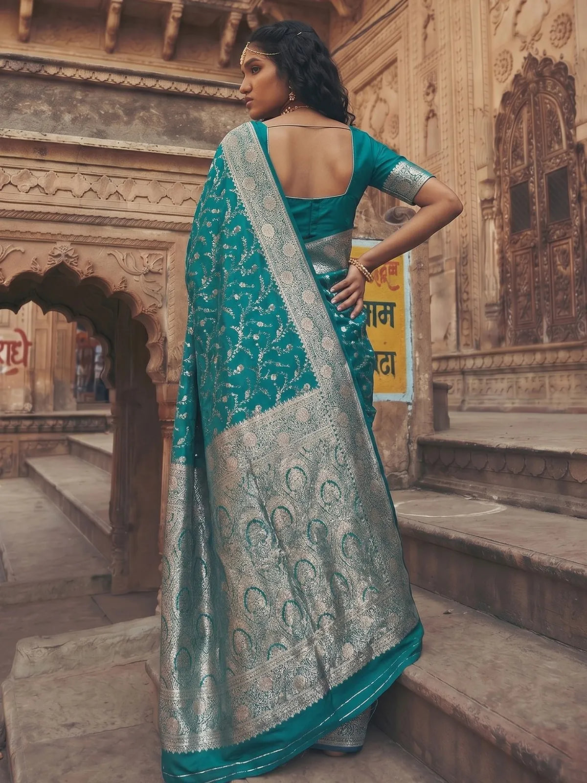 Tarani Kanika teal Art Silk saree back view with blouse design and grand zari pallu