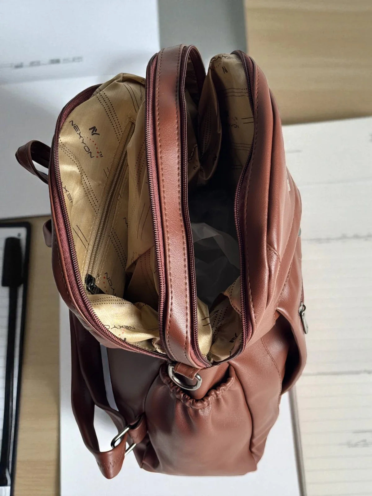 Tarani brown PU leather backpack spacious compartments with premium lining