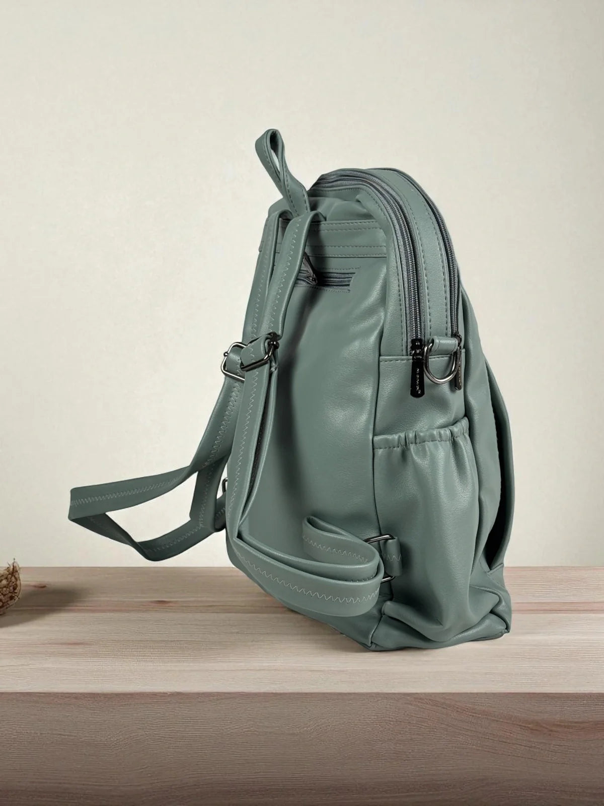 Tarani PU leather green backpack side view
