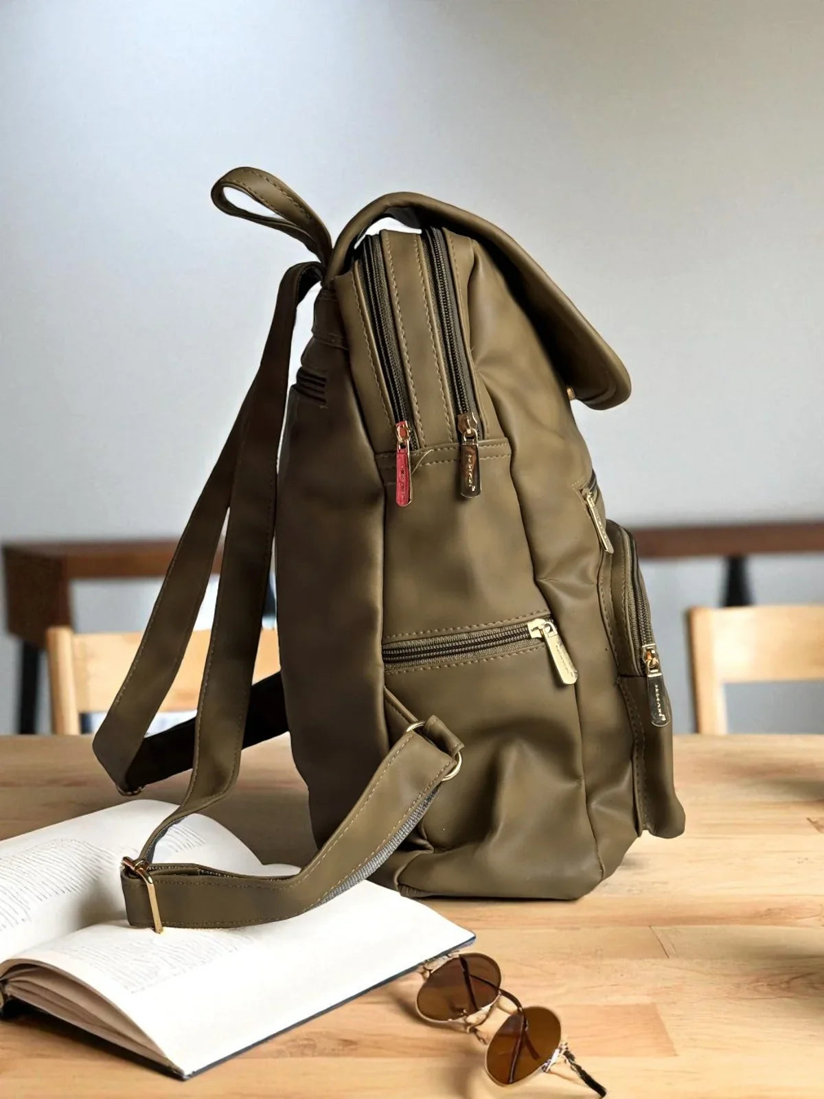 Tarani olive PU leather backpack side view with zippers