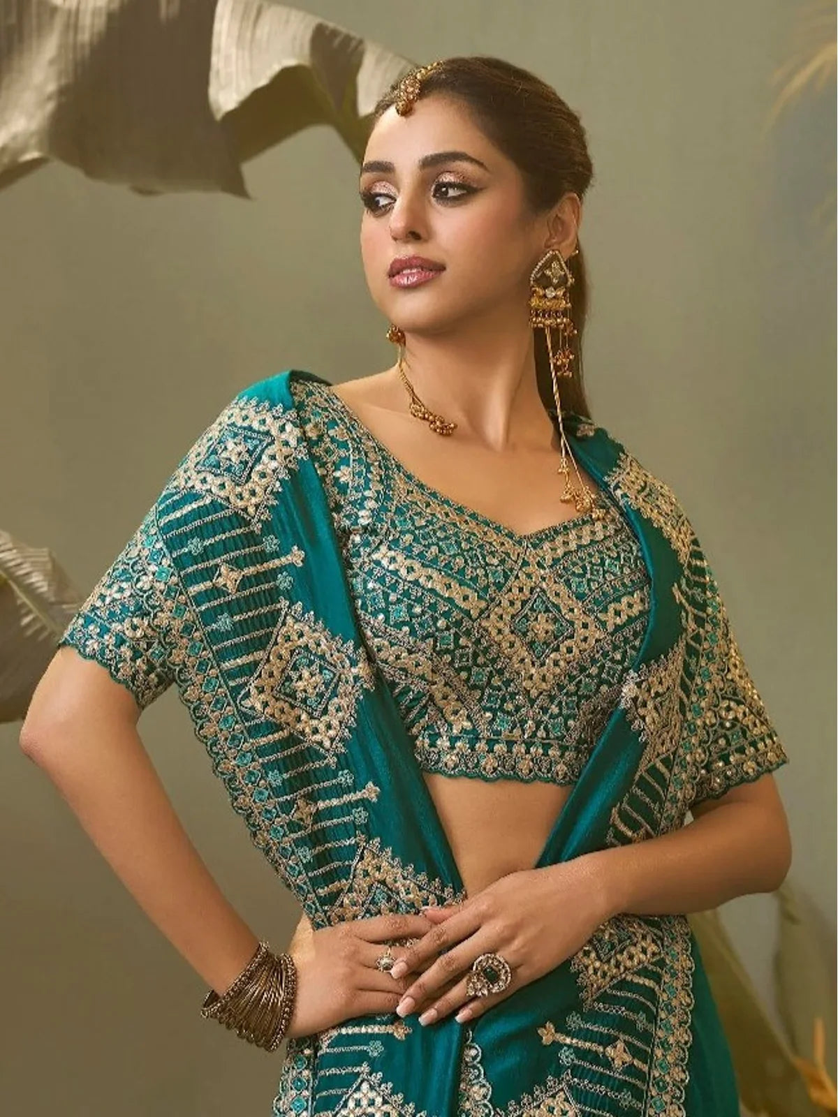 Tarani teal bamber silk saree blouse close-up showcasing detailed embroidery pattern