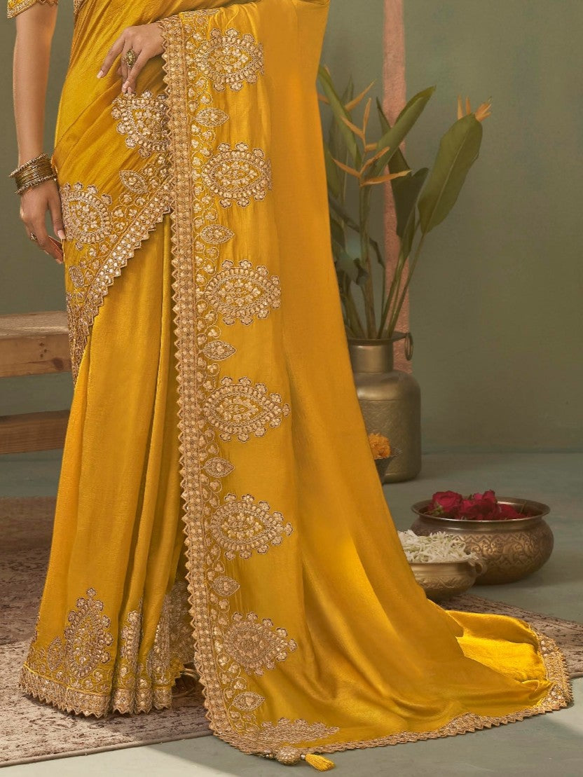 Tarani yellow bamber silk saree close-up showing intricate gota patti border and detailing