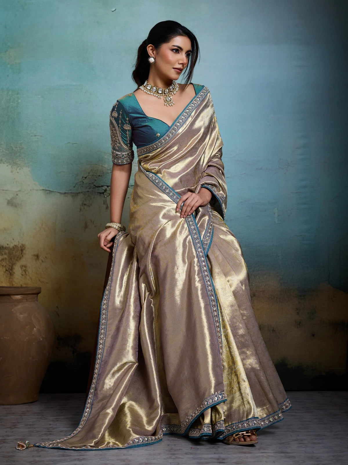 Tarani premium golden Banarasi saree front pose with detailed border and blouse