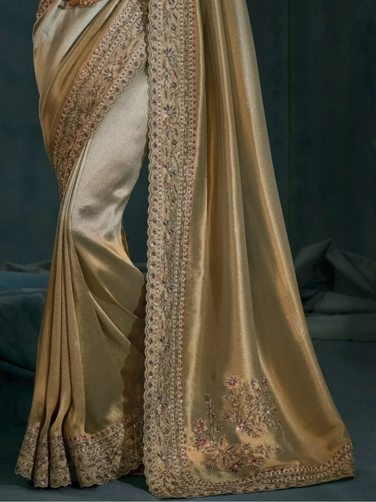 Tarani golden banarasi saree pallu view with rich border and floral embroidery