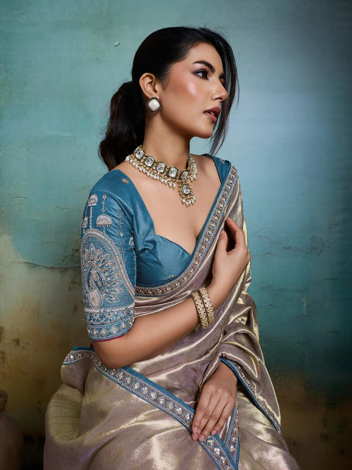 Tarani elegant golden Banarasi saree side pose with handcrafted border detailing