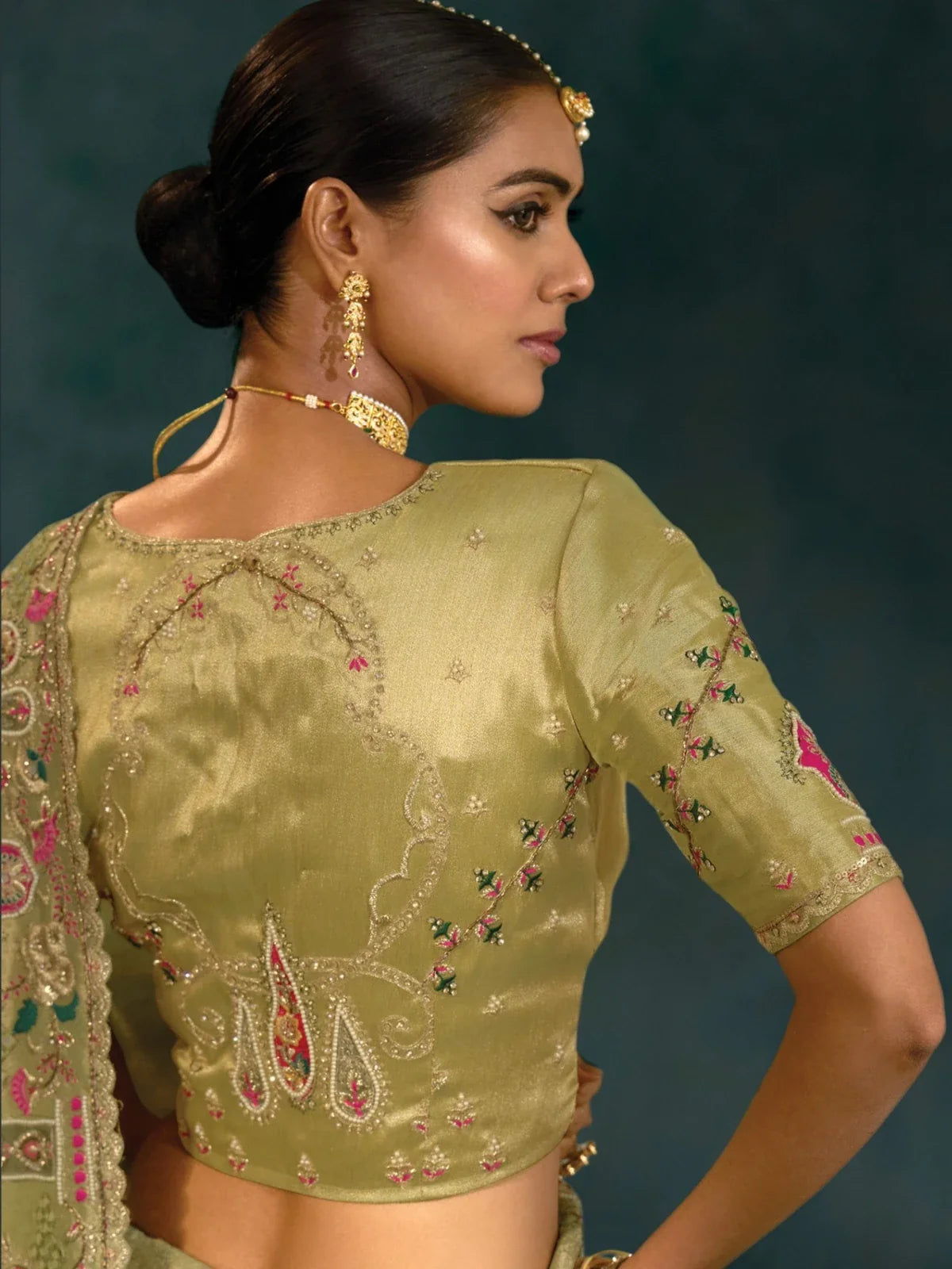 Tarani green banarasi saree blouse close-up with detailed embroidery and zari work