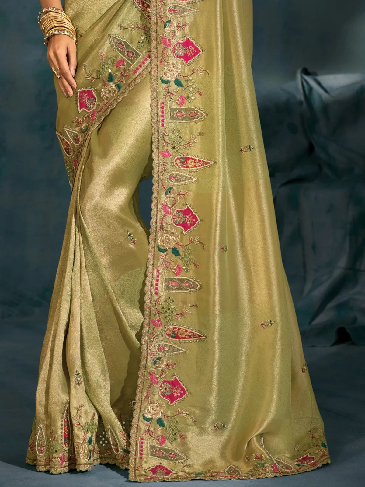 Tarani green banarasi saree pallu with intricate zari border and pink floral motifs