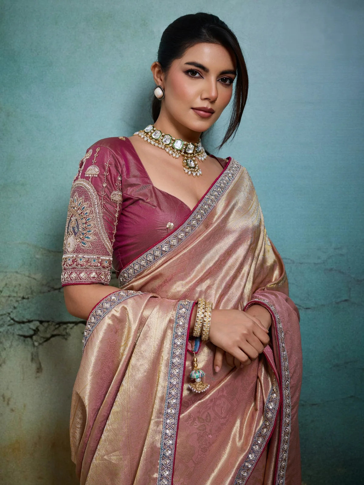 Tarani pink self woven tissue Banarasi saree upper body view with heavy blouse sleeve work