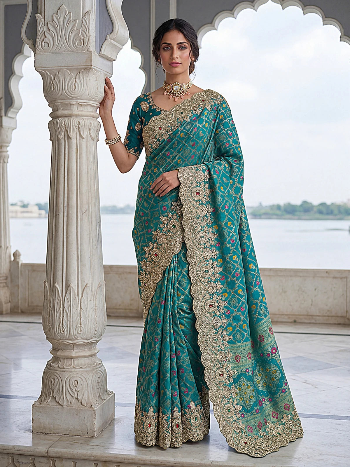 Tarani teal Banarasi silk saree front pose with ornate embroidered border