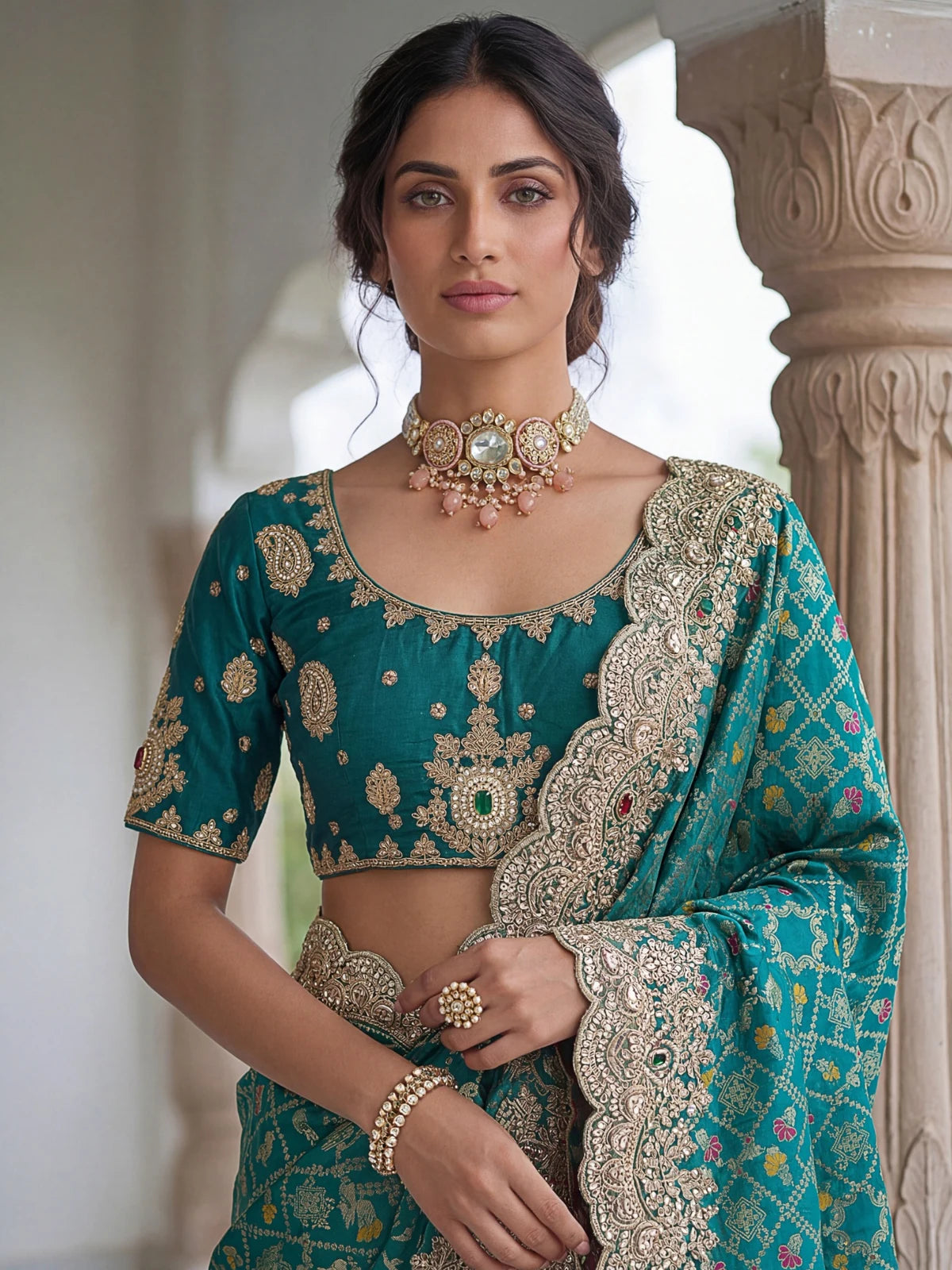 Tarani teal Banarasi silk saree blouse and neckline embroidery upper body view