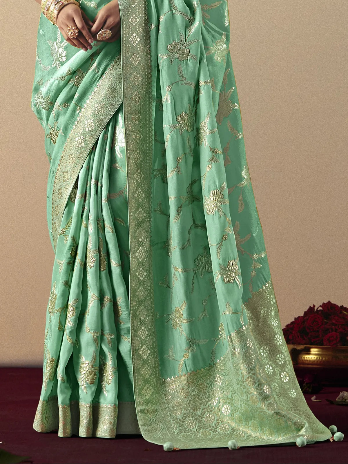 Tarani closeup detailing of green bemberg viscose saree with golden weaving work