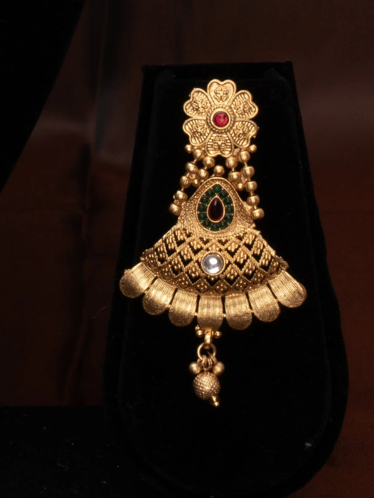 Tarani designer bridal set with earrings and layered necklace styled in antique gold finish for weddings