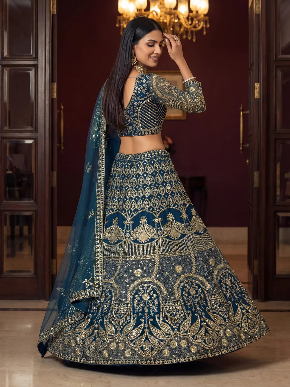 Tarani premium blue lehenga with embroidered back blouse and dupatta drape