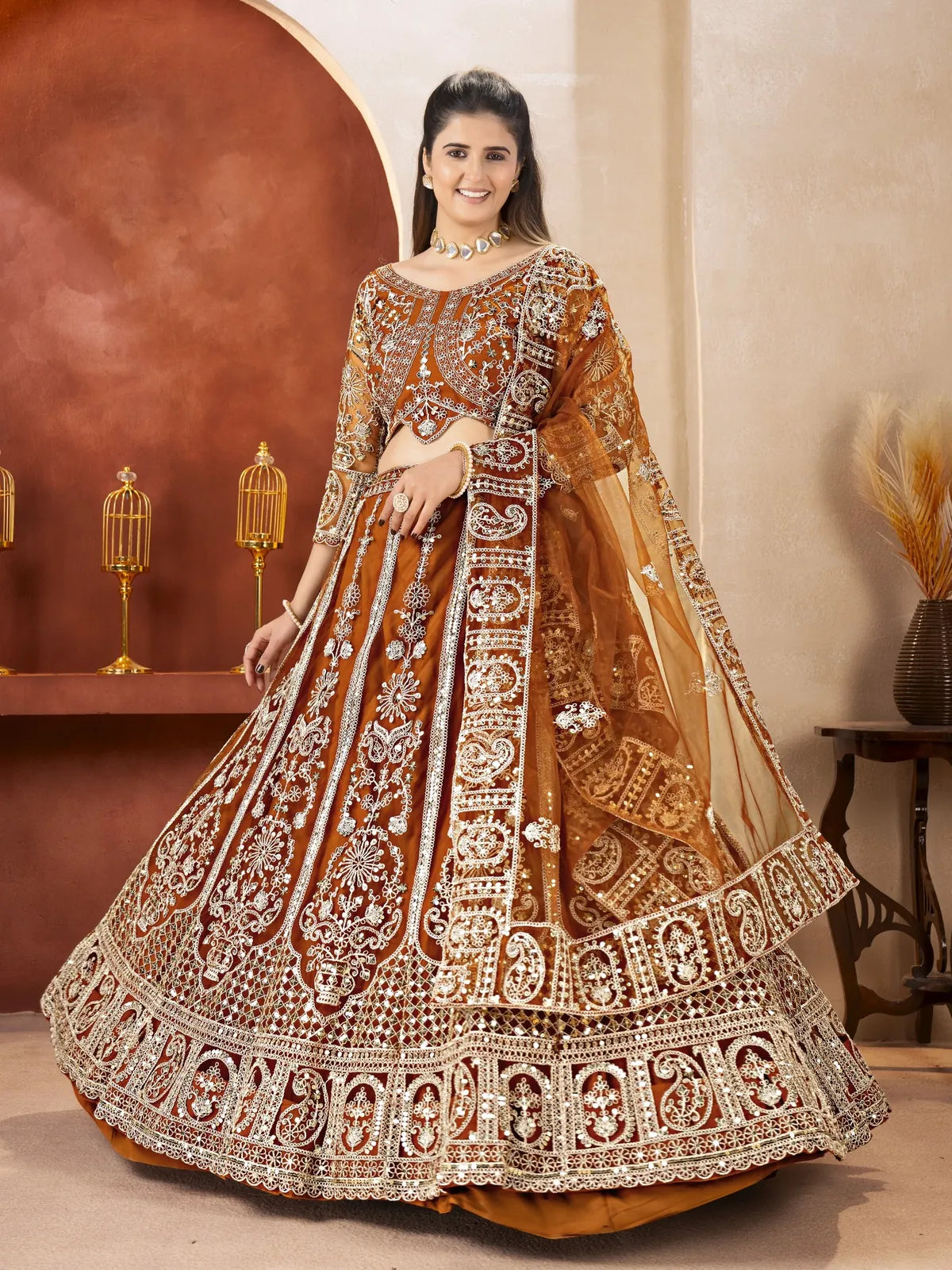 Tarani brown butterfly net lehenga with heavy embroidery and full view