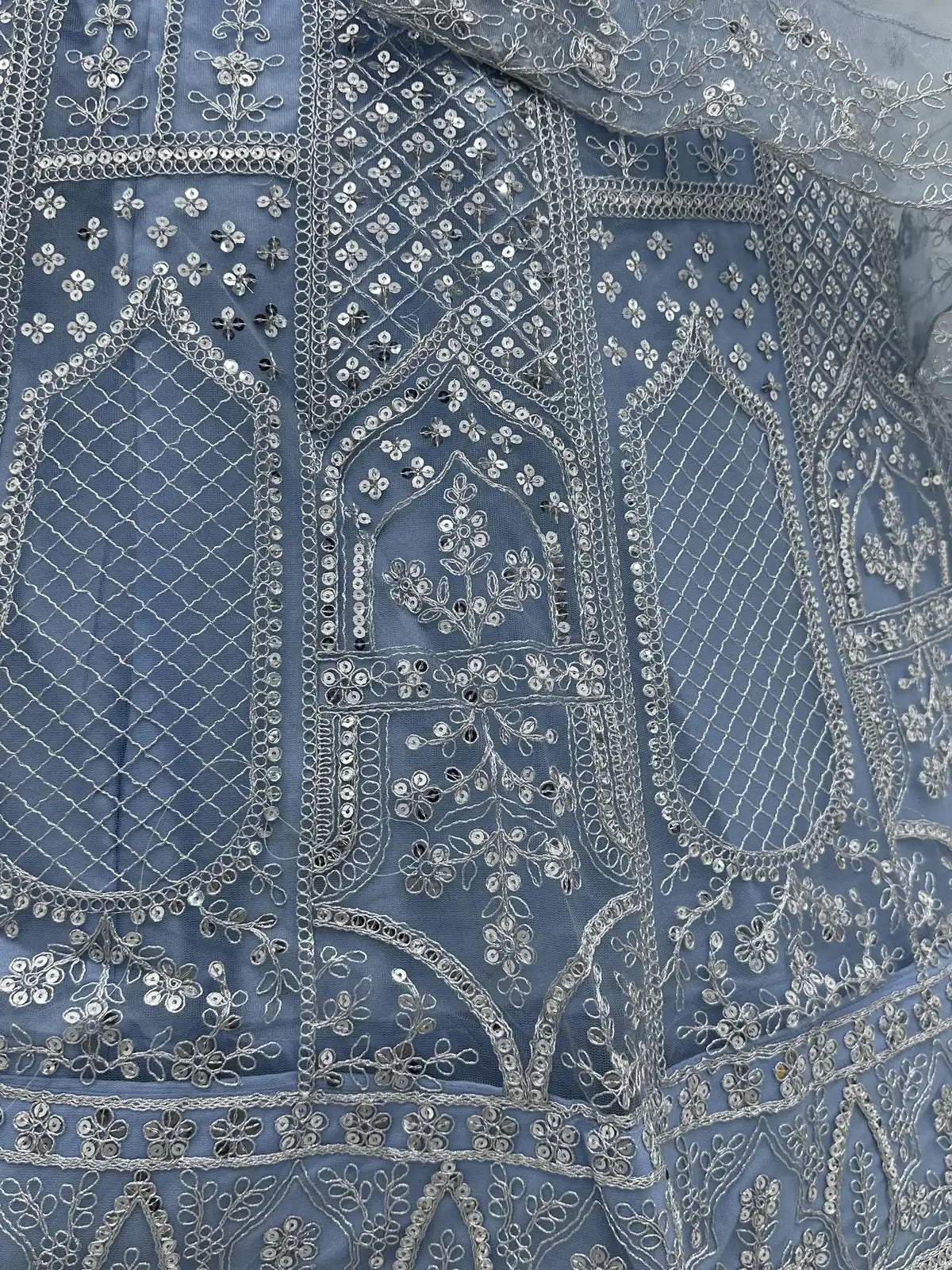 Tarani close-up showing lehenga embroidery details with sequins and floral thread work