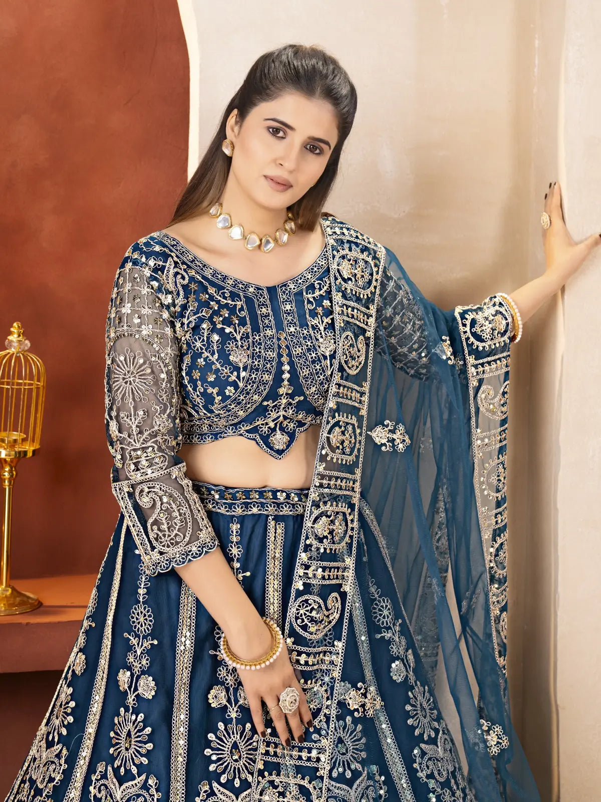 Tarani navy blue butterfly net lehenga showing upper body embroidery and blouse details