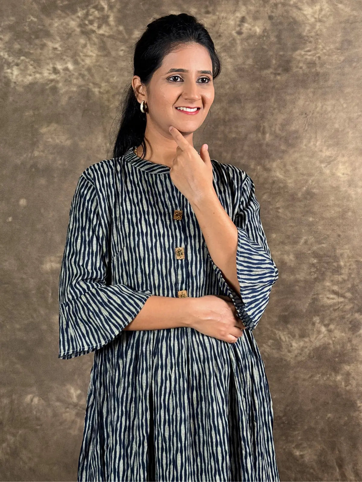 Tarani capsule cotton midi dress upper body view showing striped pattern and buttons