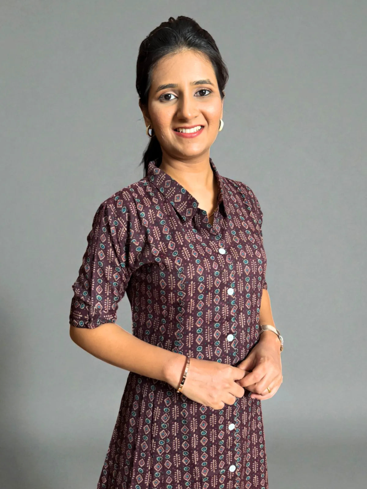 Tarani maroon capsule cotton dress close-up showing collar, buttons and sleeve styling