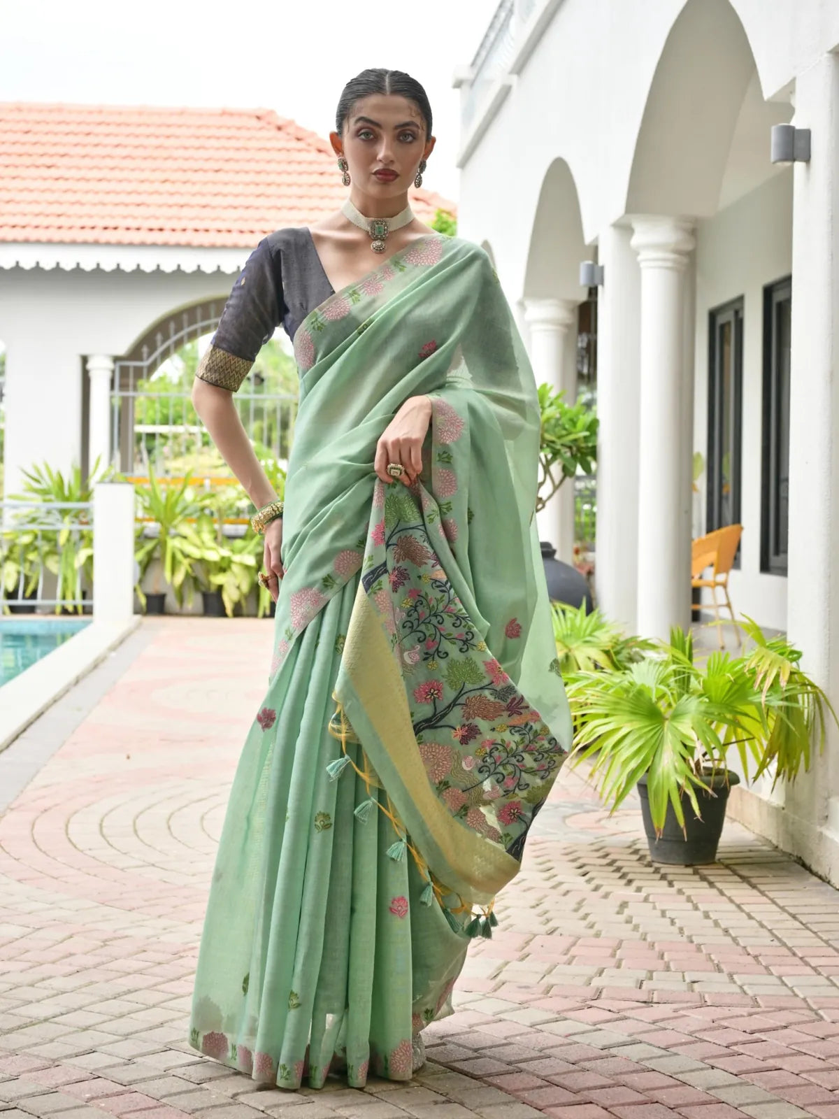 Tarani premium soft green Chanderi cotton saree with floral motifs and black blouse full view