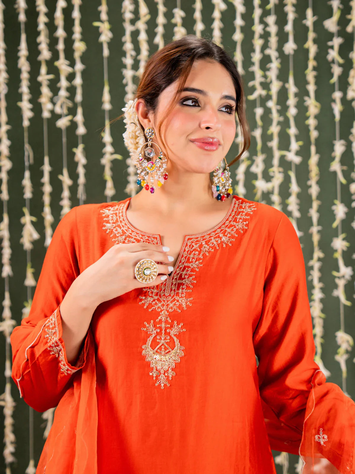 Tarani orange chanderi dress closeup showcasing neckline embroidery and festive styling