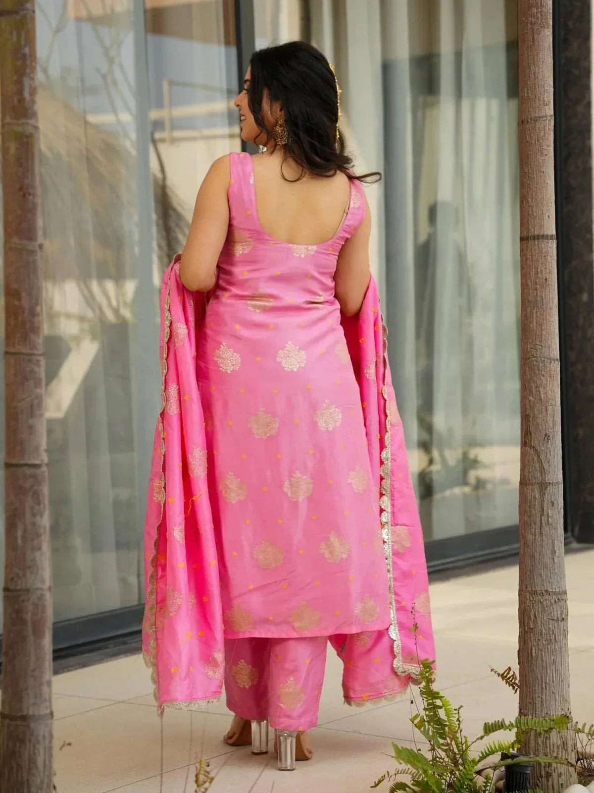 Tarani back view of pink chanderi festive dress with sleeveless cut and golden motifs