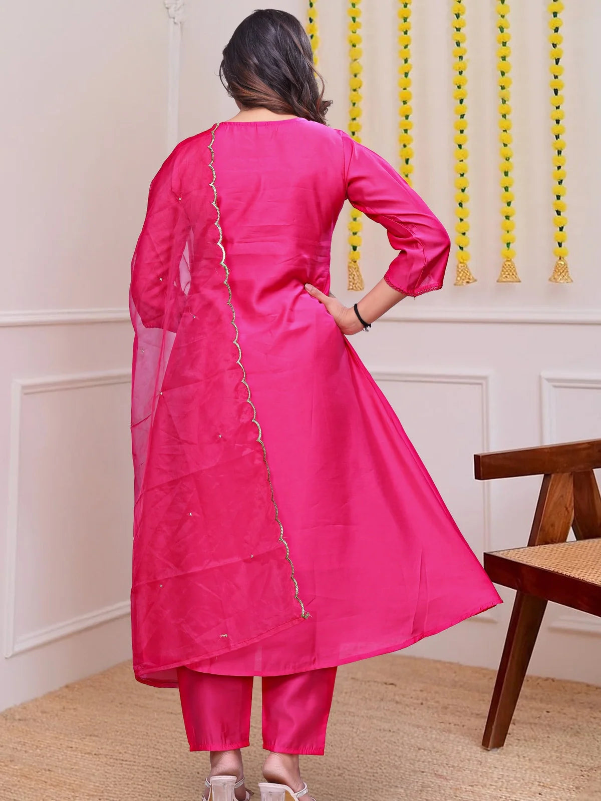 Tarani back view of pink chanderi festive dress with organza dupatta and pants