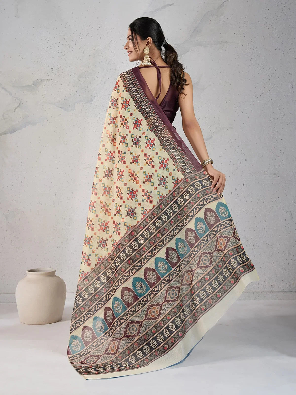 Back view of cream chanderi saree from Tarani with soft digital patterns and elegant fall