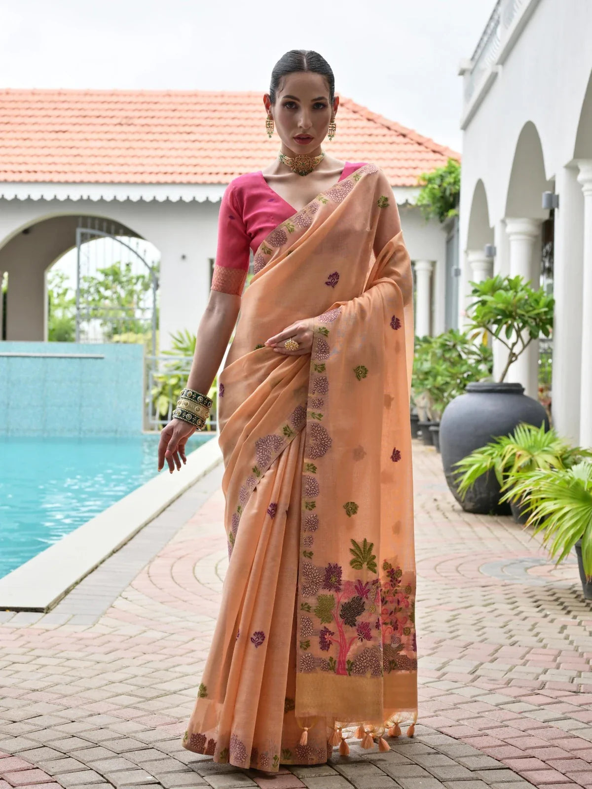 Tarani premium peach Chanderi cotton saree with floral motifs and contrast pink blouse