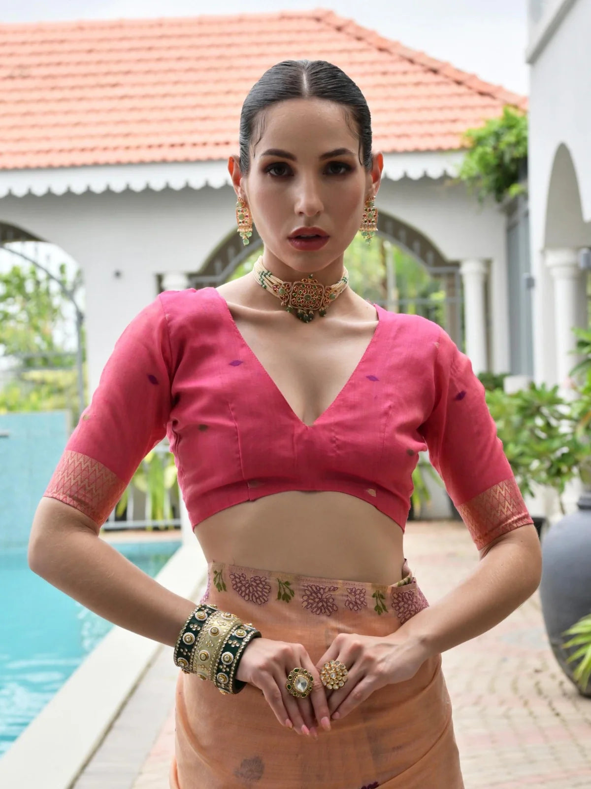 Tarani saree close-up of pink blouse with antique choker and zari border