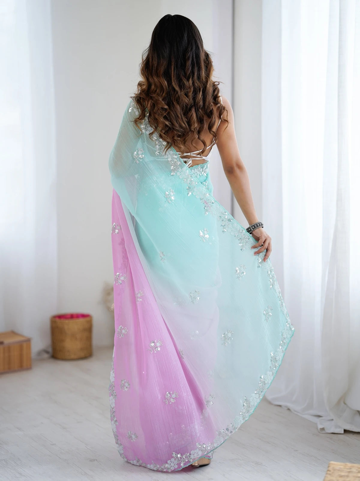 Tarani Damyanti chiffon crush saree back view with embroidered border and flowing drape