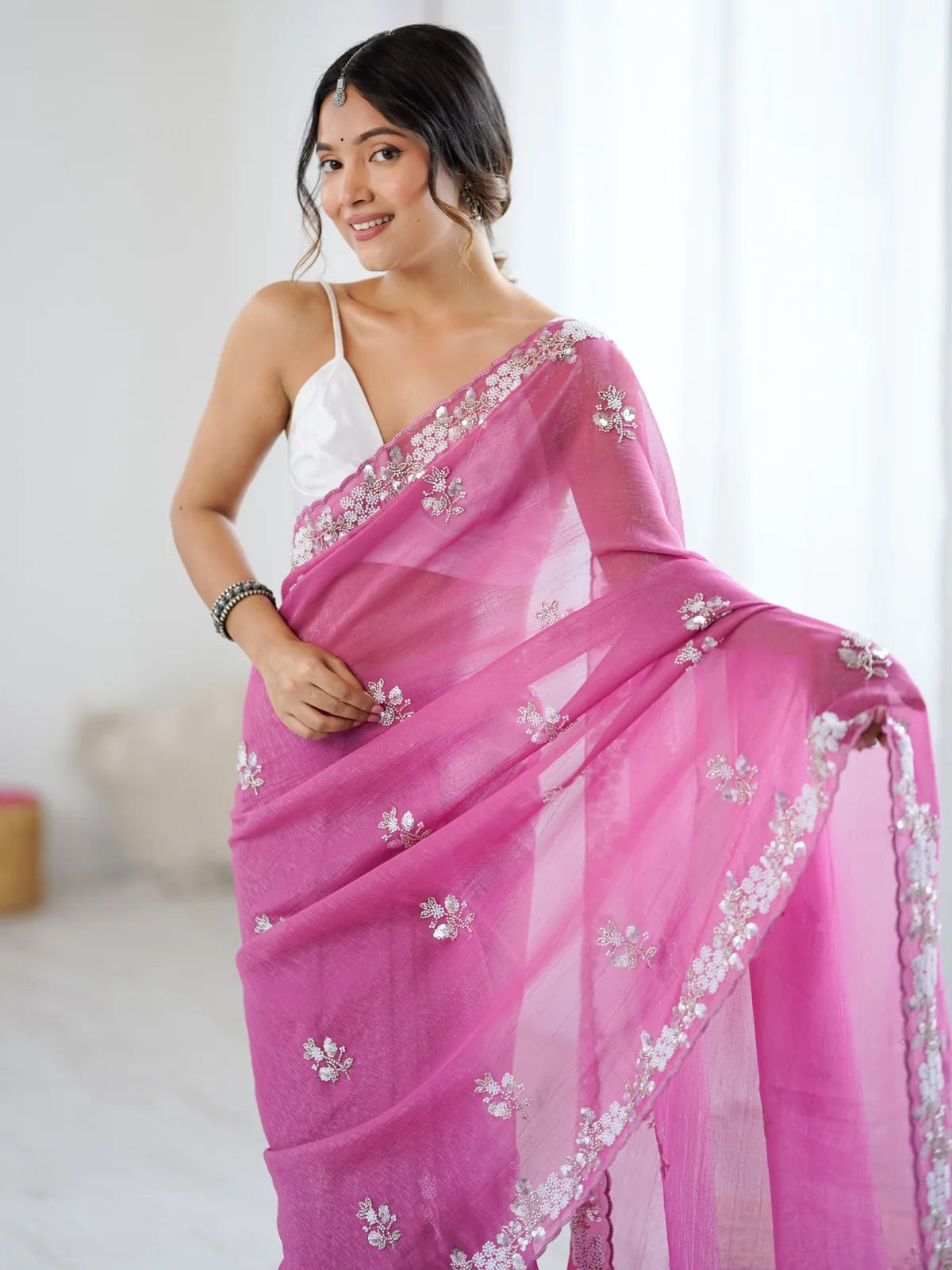 Tarani Mugdha pink chiffon crush saree upper body view with embroidered border and elegant drape