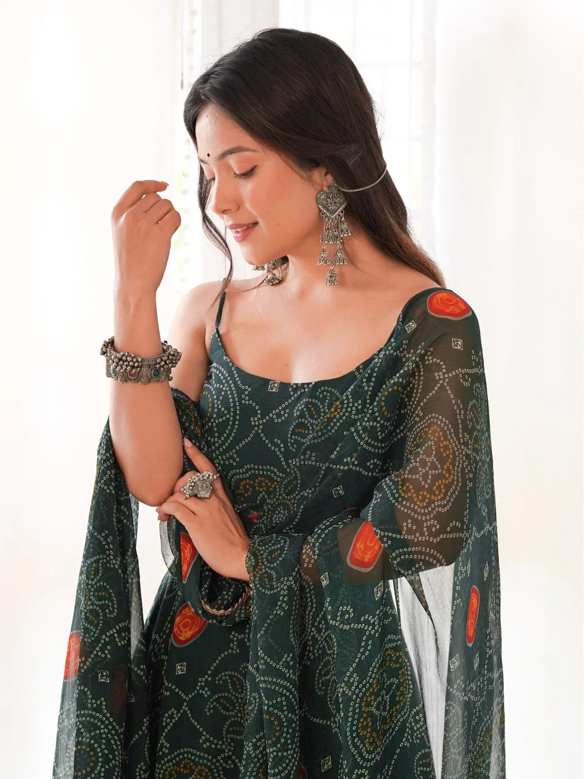 Tarani green chiffon gown with soft flow and elegant shoulder drape - upper body close-up
