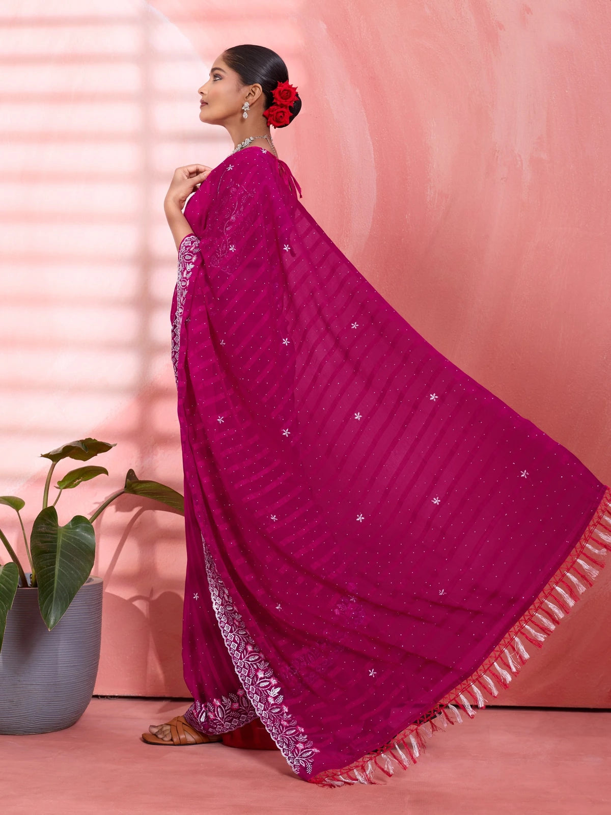 Tarani magenta chiffon saree pallu view with silver border and tassel detailing