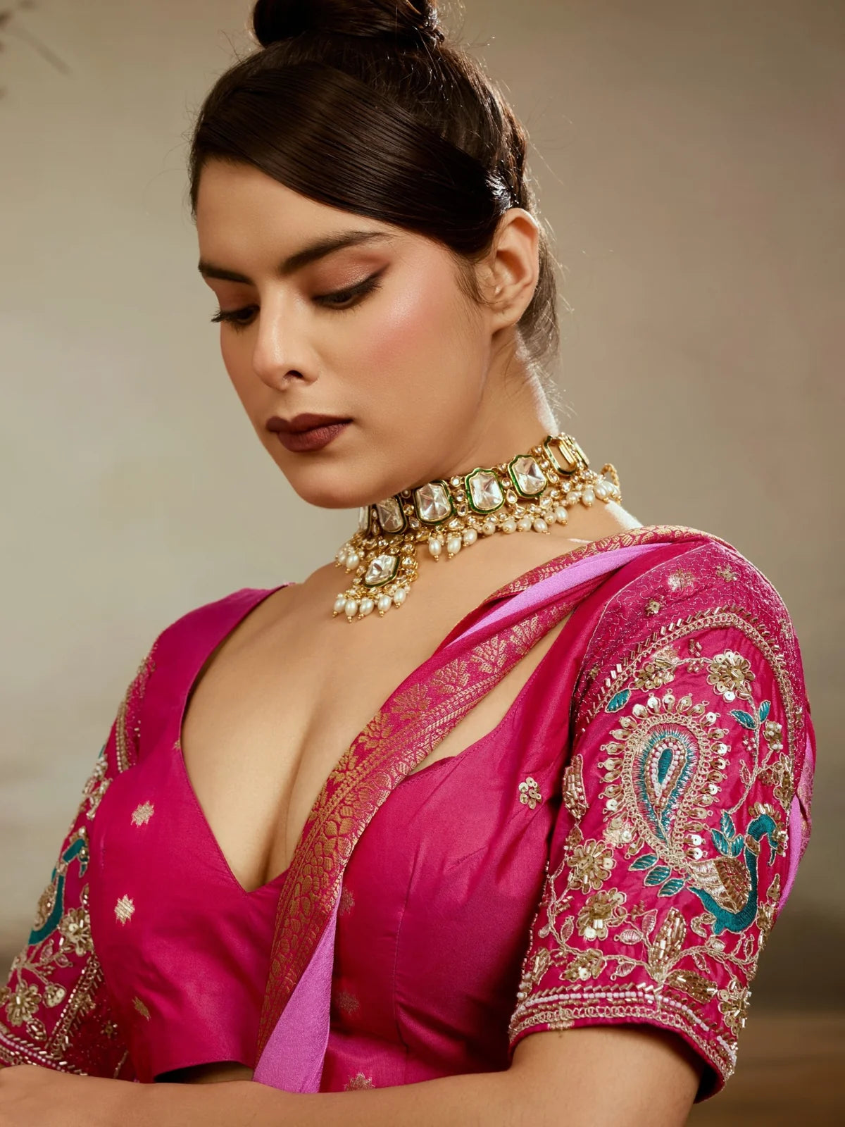 Tarani designer blouse view with intricate sleeve embroidery and pink saree styling