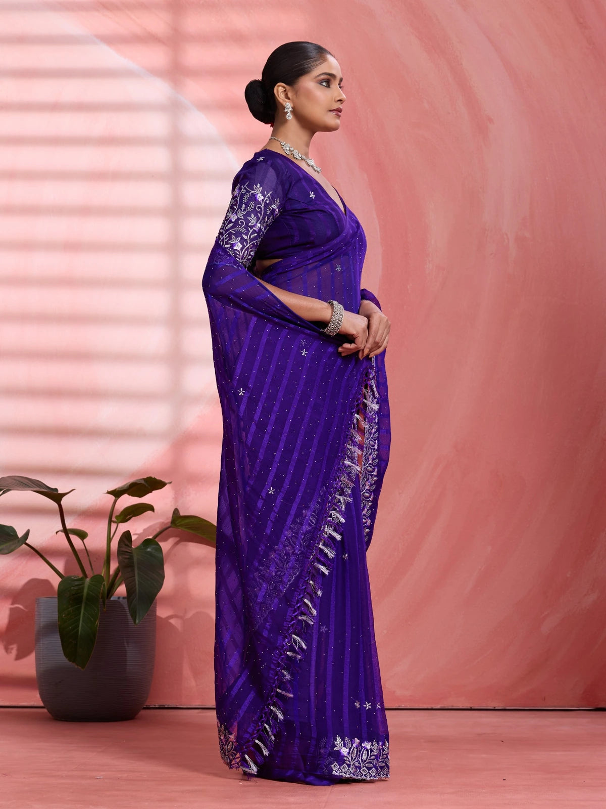 Tarani purple chiffon saree side view with elegant pallu and border work
