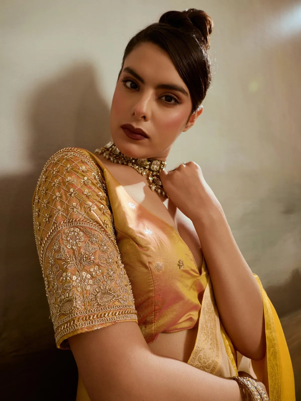 Tarani handwork blouse sleeve closeup with yellow chiffon saree detailing