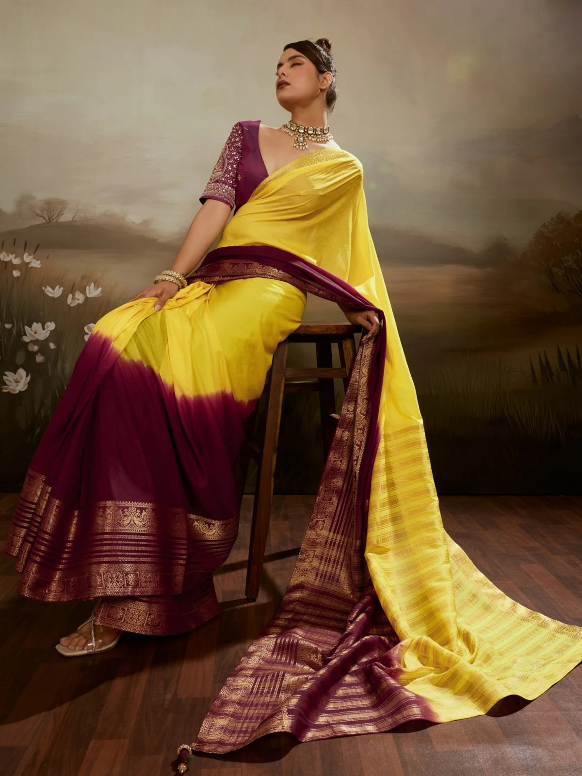Tarani yellow chiffon saree pallu view with zari woven border and tassels