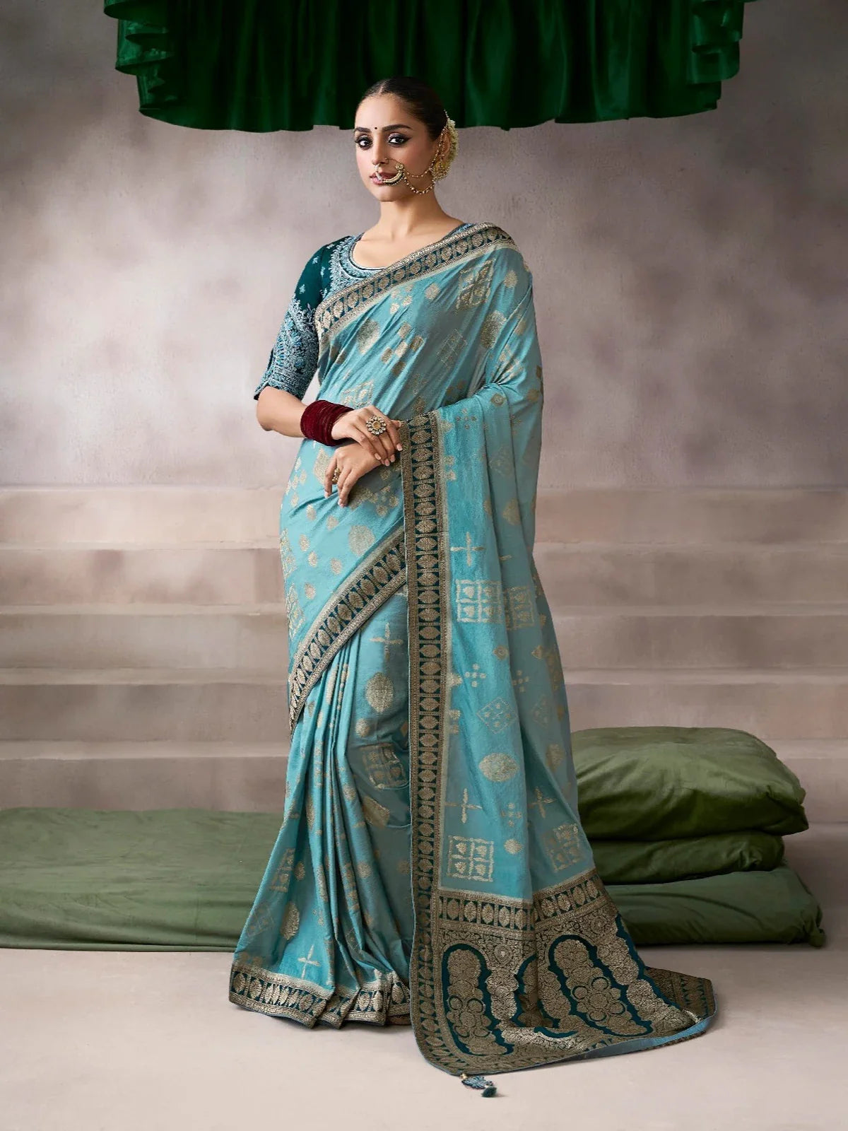 Tarani chiffon-silk blue saree full view with golden woven motifs and elegant border