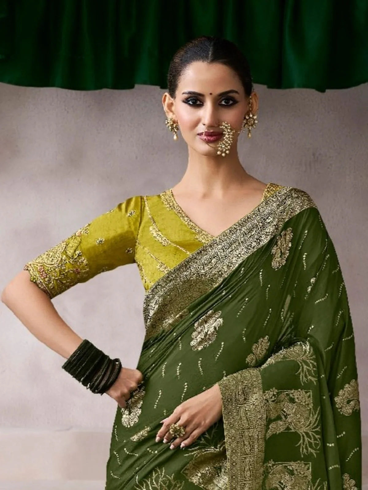 Tarani green chiffon silk saree with embroidered golden blouse - upper body model pose