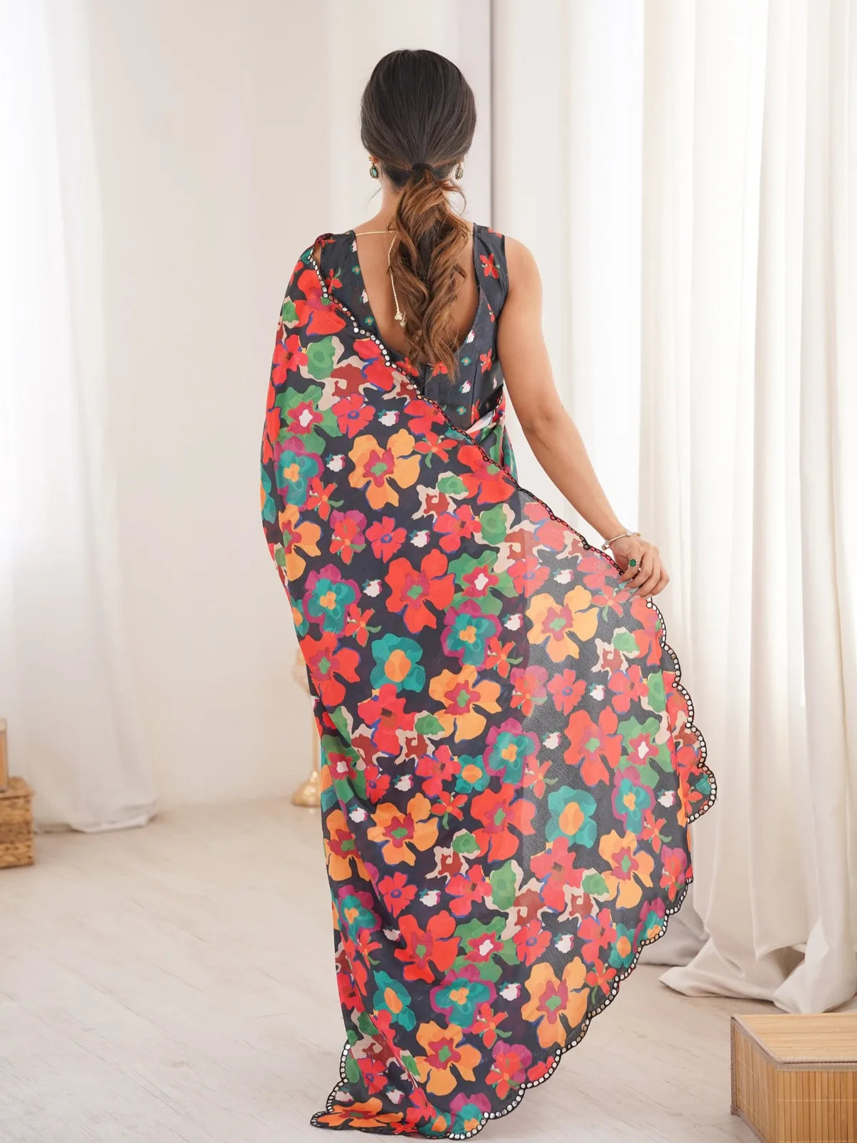 Tarani heavy chinnon black floral print saree with mirror border back view