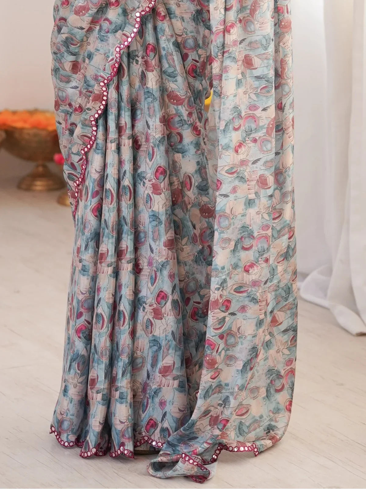 Closeup of printed design and mirror border on Tarani chinnon saree