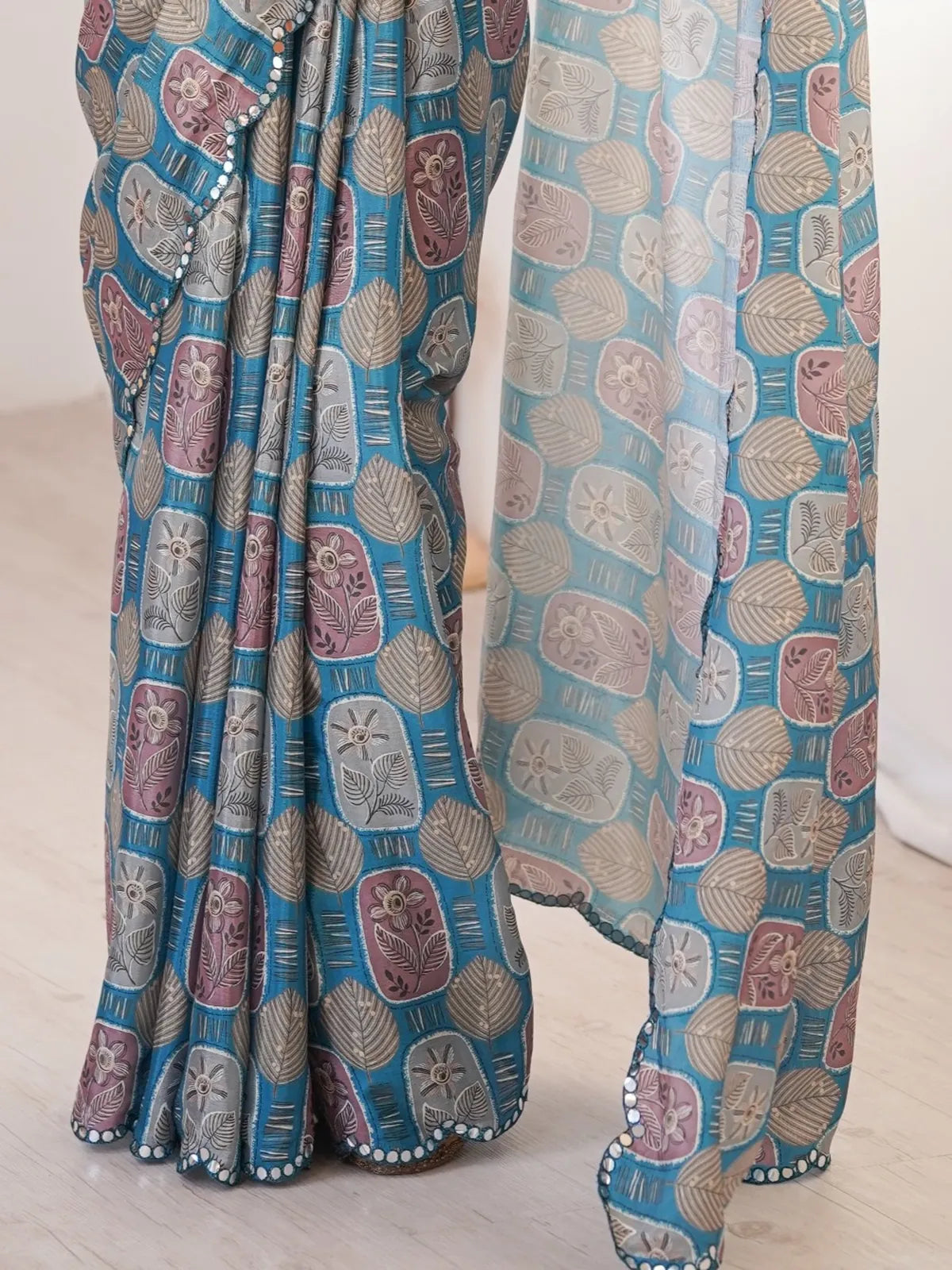Tarani printed chinnon saree detailing with multicolor block and leaf motifs