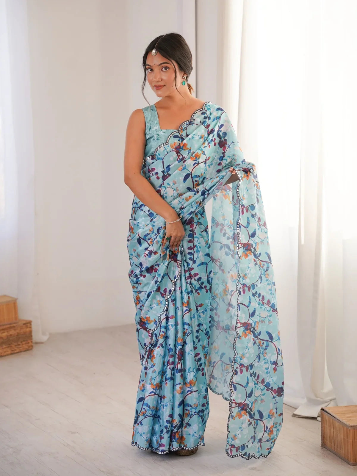 Tarani elegant blue printed heavy chinnon saree with pape mirror border and floral detailing front view