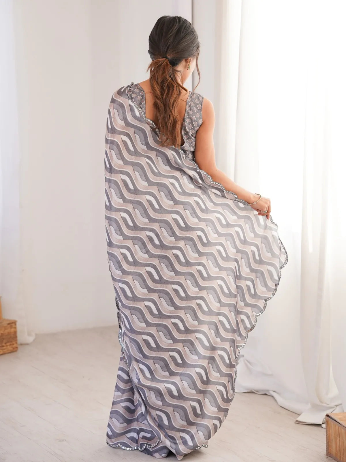 Back view of Tarani grey saree with blouse showing elegant drape and detailing