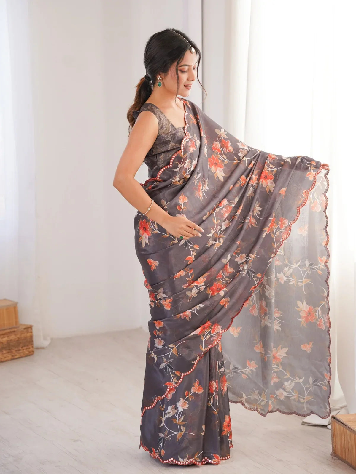 Tarani grey saree side pose showing floral print and scalloped pallu with mirror work