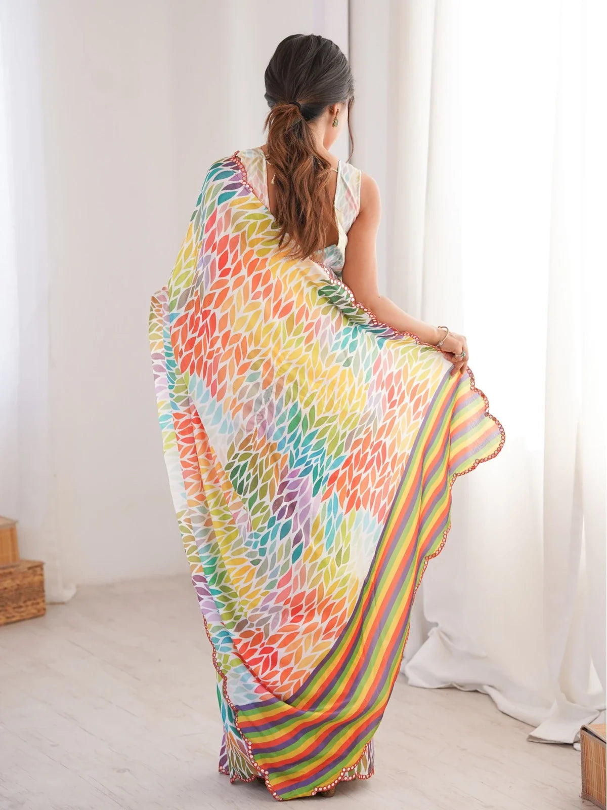 Back view of Tarani chinnon saree showcasing mirror edge and print detailing