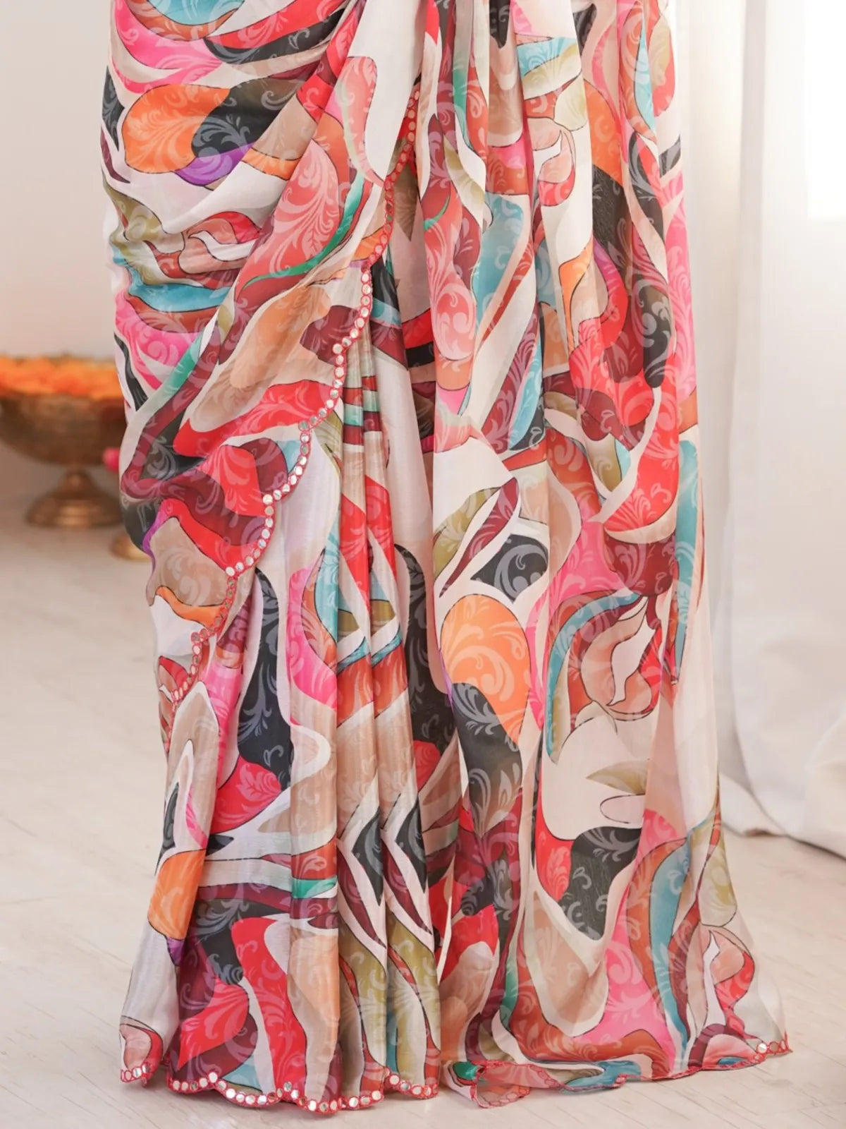 Tarani saree closeup highlighting chinnon fabric with vibrant multicolor print