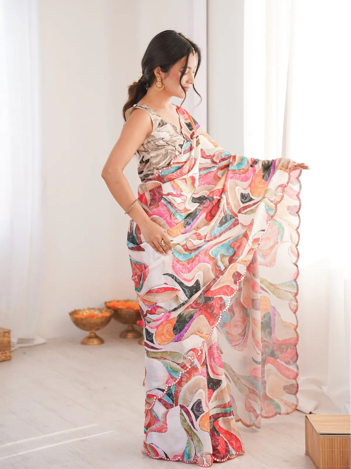 Tarani saree side view displaying light flow and festive design detailing